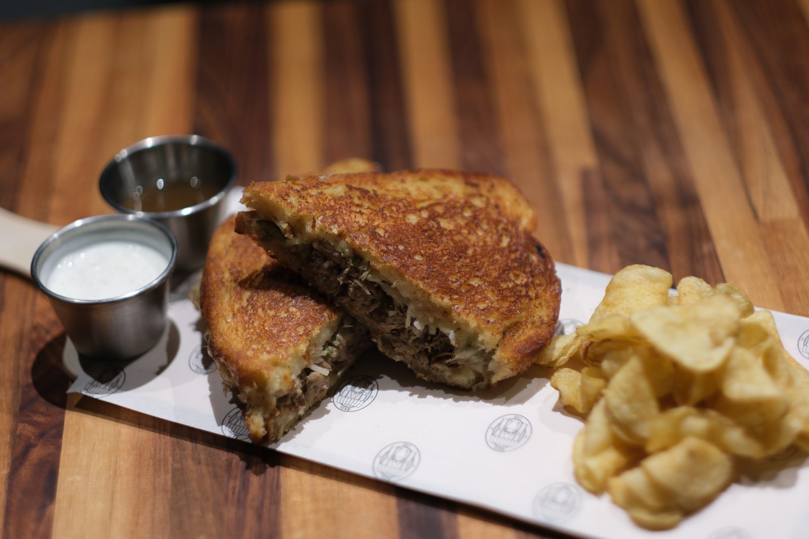Adobo jalapeño melt on sourdough with potato jalapeño chips and dips